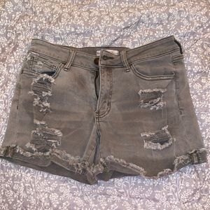 Destroyed faded green low rise shorts